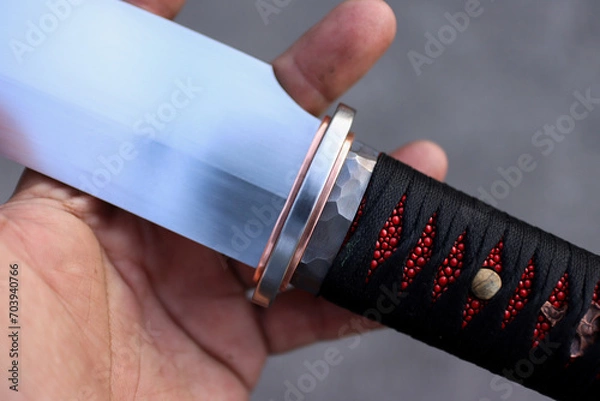 Fototapeta Red and black colure with tanto knife handle wraping