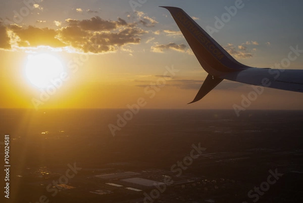 Obraz airplane flying over the ocean