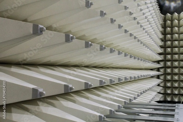 Obraz Soft hybrid pyramidal microwave and radio frequency absorbers close up. Electromagnetic compatibility measurements absorbers in anechoic chamber with soundproof walls for scientific experiments