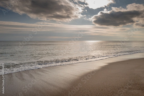 Obraz Sunset at beach with cloudy sky