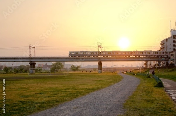 Obraz setting sun and train