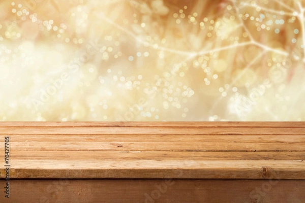 Fototapeta Golden bokeh background with empty wooden table
