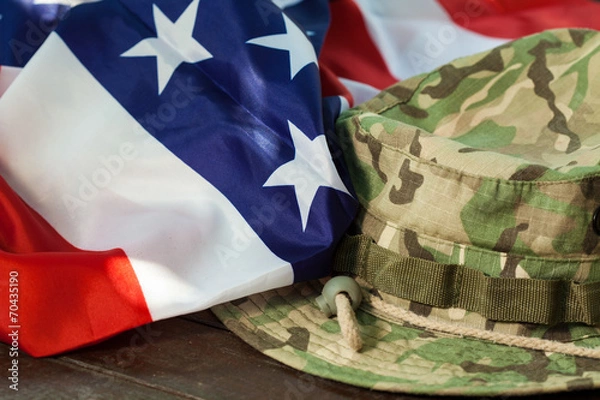 Obraz US flag with camouflage combat hat