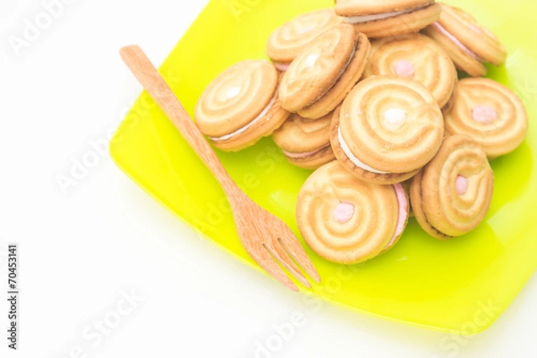 Obraz cookies on green disk with wood fork