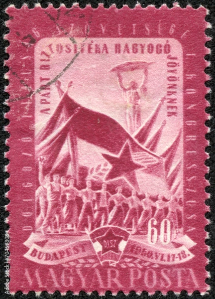 Fototapeta stamp shows worker, peasant and student and flags