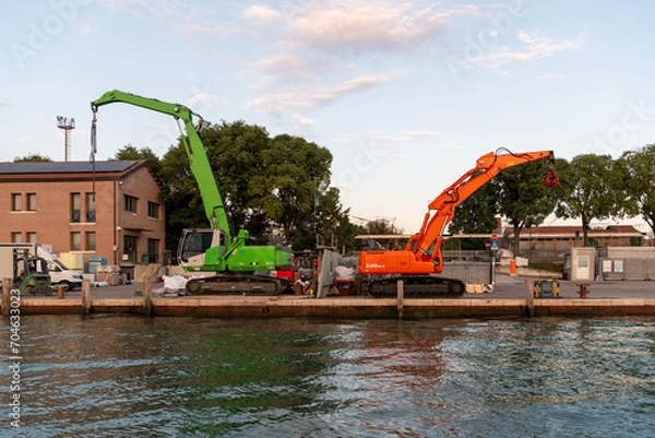 Obraz Orange and green crane. Construction works