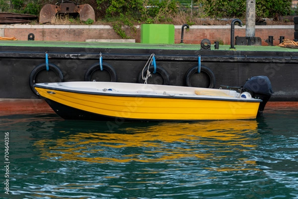 Obraz Yellow boat parked at the pier