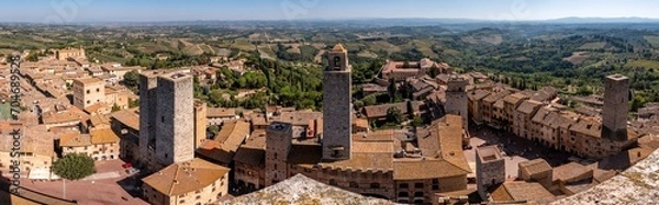 Fototapeta Wide panoramic view over downtown San Gimignano, Torri dei Salvucci and Torre Rognosa in the center, seen from Torre Grosso