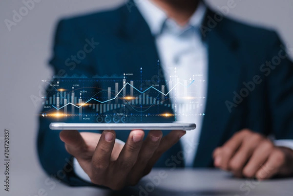 Obraz Digital online marketing, Financial and investment business planning and development. Businessman analyzing growth sales data graph on virtual screen.