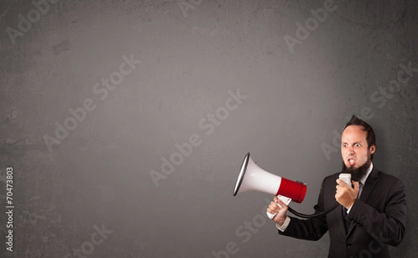 Obraz Guy shouting into megaphone on copy space background