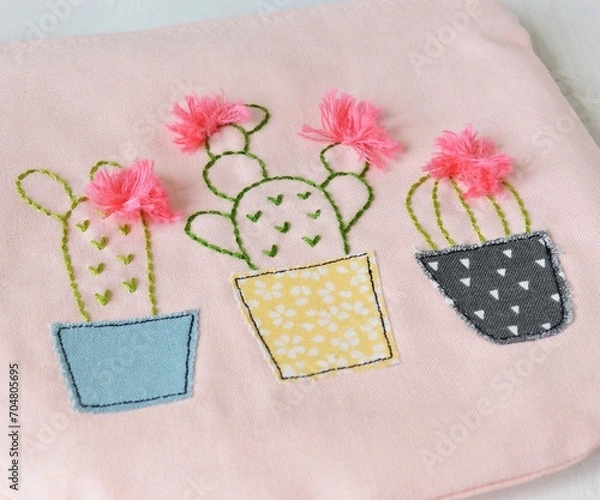 Fototapeta Pink handmade zipper pouch with cute cacti in pots