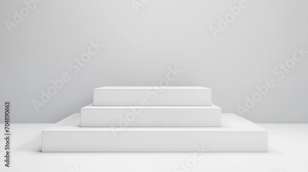 Fototapeta a clean, sleek design with a set of three white ascending rectangular platforms, against a soft grey background for beauty skincare cosmetic products display backdrop