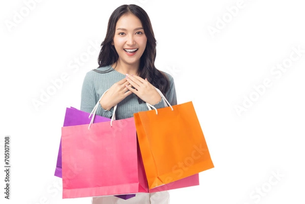 Obraz Portrait excited beautiful asian woman holding shopping bags isolated on white background and copy space Surprise happy asian lady open mouth with excited Beauty young female love shopping