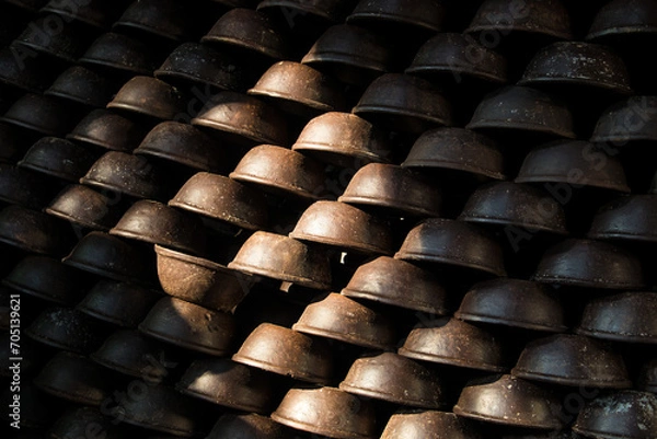 Fototapeta Pottery making involves shaping clay by hand, using a wheel, or coiling techniques.