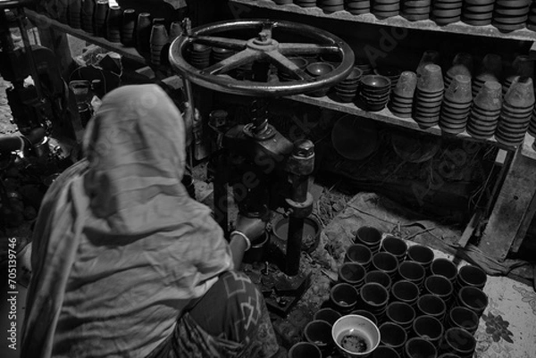 Fototapeta Pottery making involves shaping clay by hand, using a wheel, or coiling techniques.