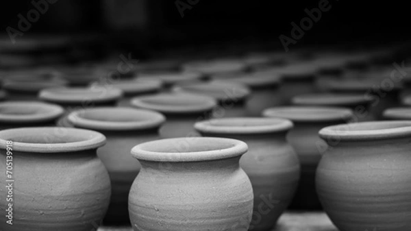 Fototapeta Pottery making involves shaping clay by hand, using a wheel, or coiling techniques.