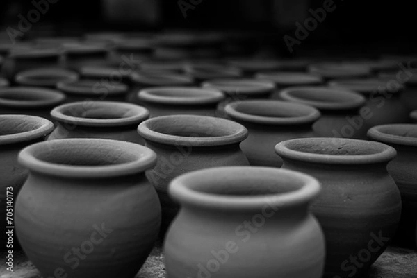 Fototapeta Pottery making involves shaping clay by hand, using a wheel, or coiling techniques.