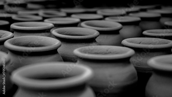 Fototapeta Pottery making involves shaping clay by hand, using a wheel, or coiling techniques.