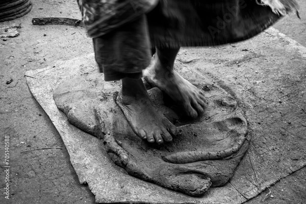 Fototapeta Pottery making involves shaping clay by hand, using a wheel, or coiling techniques.