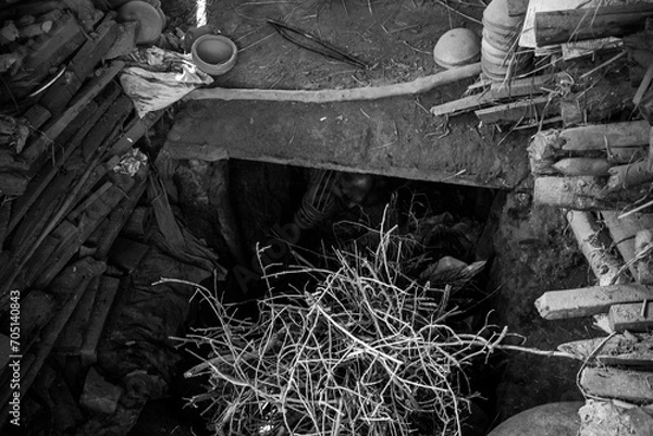 Fototapeta Pottery making involves shaping clay by hand, using a wheel, or coiling techniques.