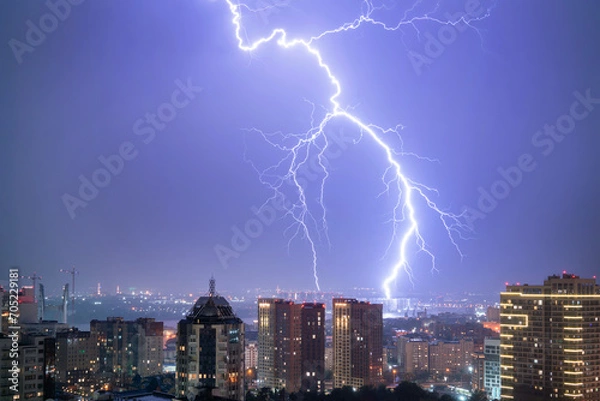 Obraz Lightning in the night sky over the city.