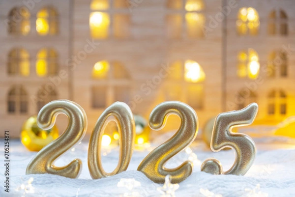 Fototapeta Golden figures number 2025 against the background of cozy windows of a house with warm light with festive decor of stars,snow and garlands. Greeting card, Happy New Year, cozy home