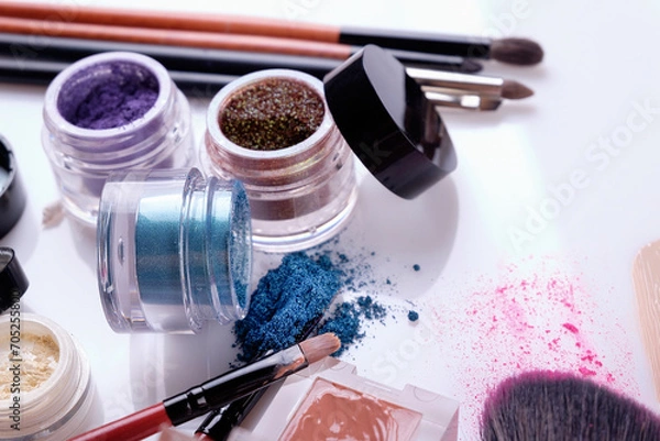 Fototapeta Professional cosmetics and brushes for make-up on a white background