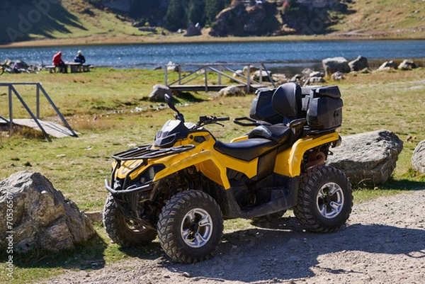 Fototapeta Yellow modern quad in nature ready for driving