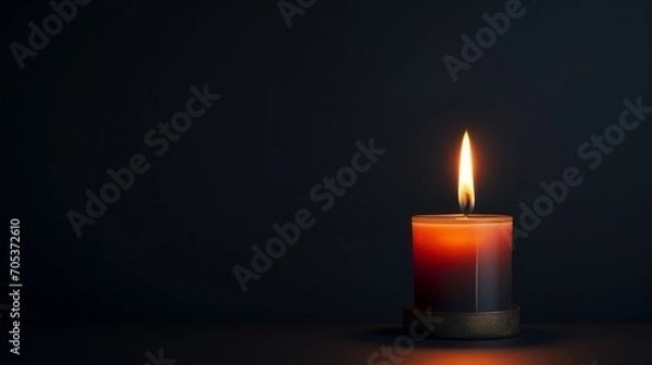 Fototapeta Minimalist view of a flickering candle in the dark  AI generated