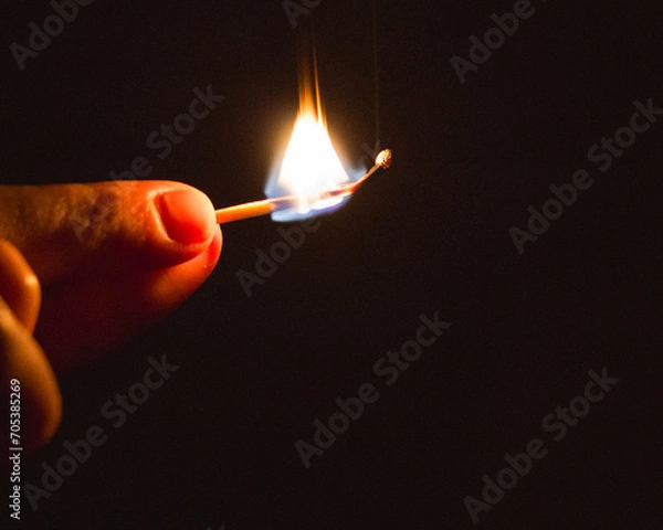 Obraz burning match in hand