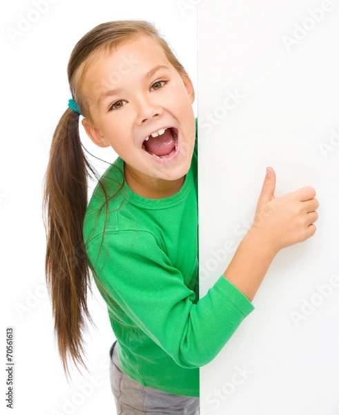 Obraz Little girl is looking from out blank board