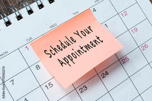 Obraz Schedule your appointment text on orange paper sticky note.