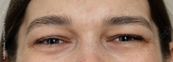 Obraz Women's eyes close-up. The upper part of the girl's face.