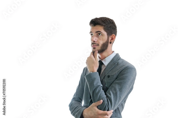 Obraz Business man thinking about something isolated on white