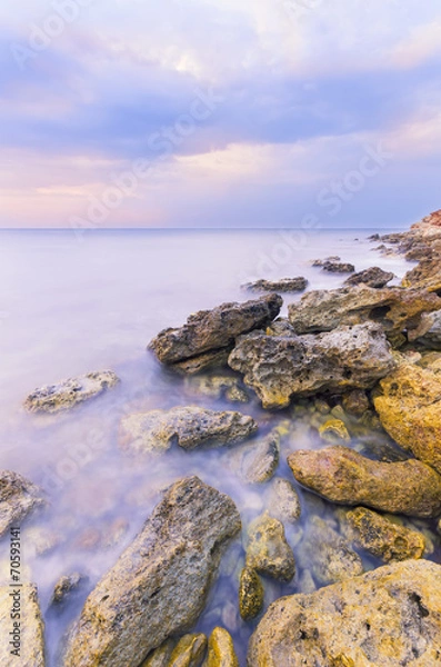 Fototapeta bright sharp rocks in the water a milky color