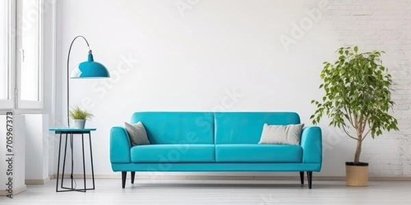 Fototapeta Modern apartment with turquoise couch and workspace against white wall.