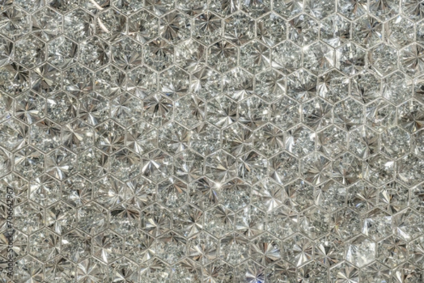 Fototapeta Brilliant diamond shape background.
Multifaceted wallpaper with sparkling lights.
