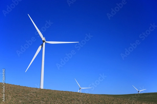 Obraz wind turbines in a landscape.