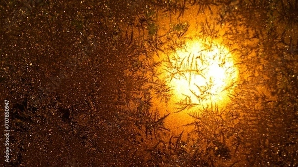 Obraz Sunrise behind frozen window