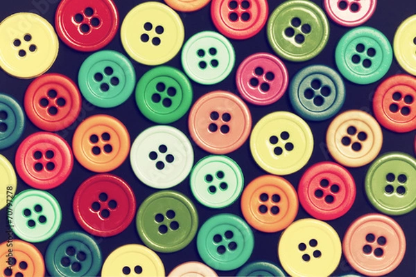 Obraz Sewing buttons on a dark background