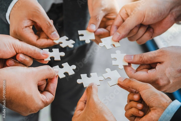 Fototapeta Business partner  and partnership Hands join Jigsaw team spirit Collaboration global community teamwork .