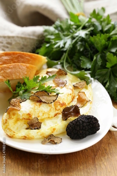 Fototapeta gourmet omelette with black truffle and herbs