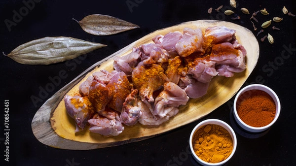 Obraz raw chicken is getting ready to be cooked 