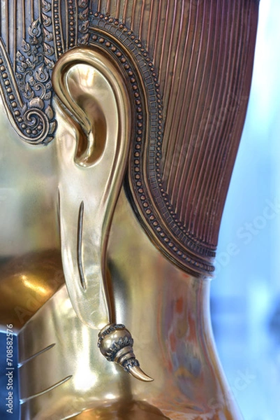 Obraz Close-up of the ear of a golden Buddha in Buddhism