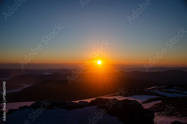 Fototapeta sunset over the mountains