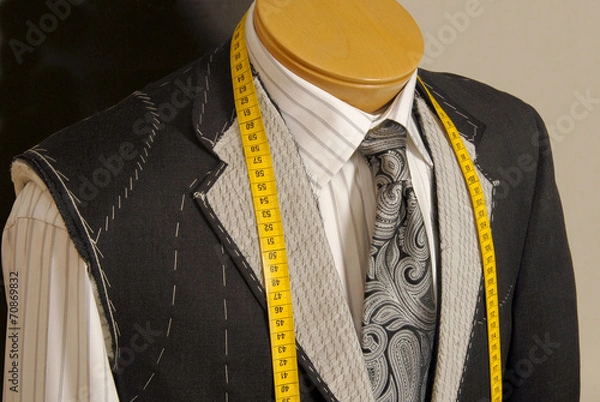 Fototapeta Tailor shop mannequin with measuring tape across neck.