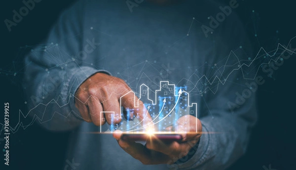 Fototapeta Businessman holding mobile phone with graph of asset business growth, Concept of business prosperity and asset management, Real estate investment marketing analysis, Planning to increase profits.