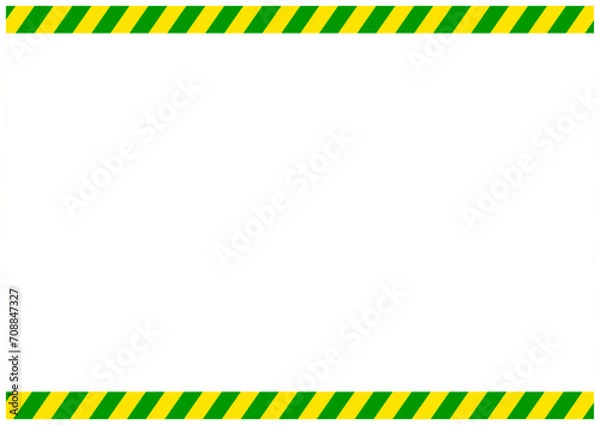 Fototapeta 災害工事現場で使う黄色と緑の危険注意の警告フレーム枠