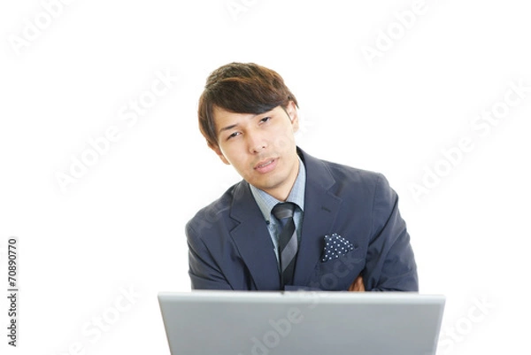 Fototapeta 疲れた表情のビジネスマン