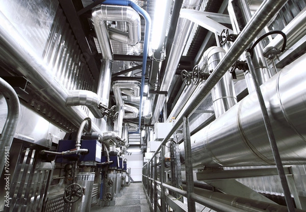 Fototapeta Equipment, cables and piping as found inside of a modern industr